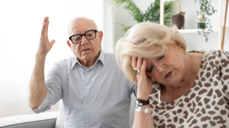 Angry elderly man shouting at despaired wife